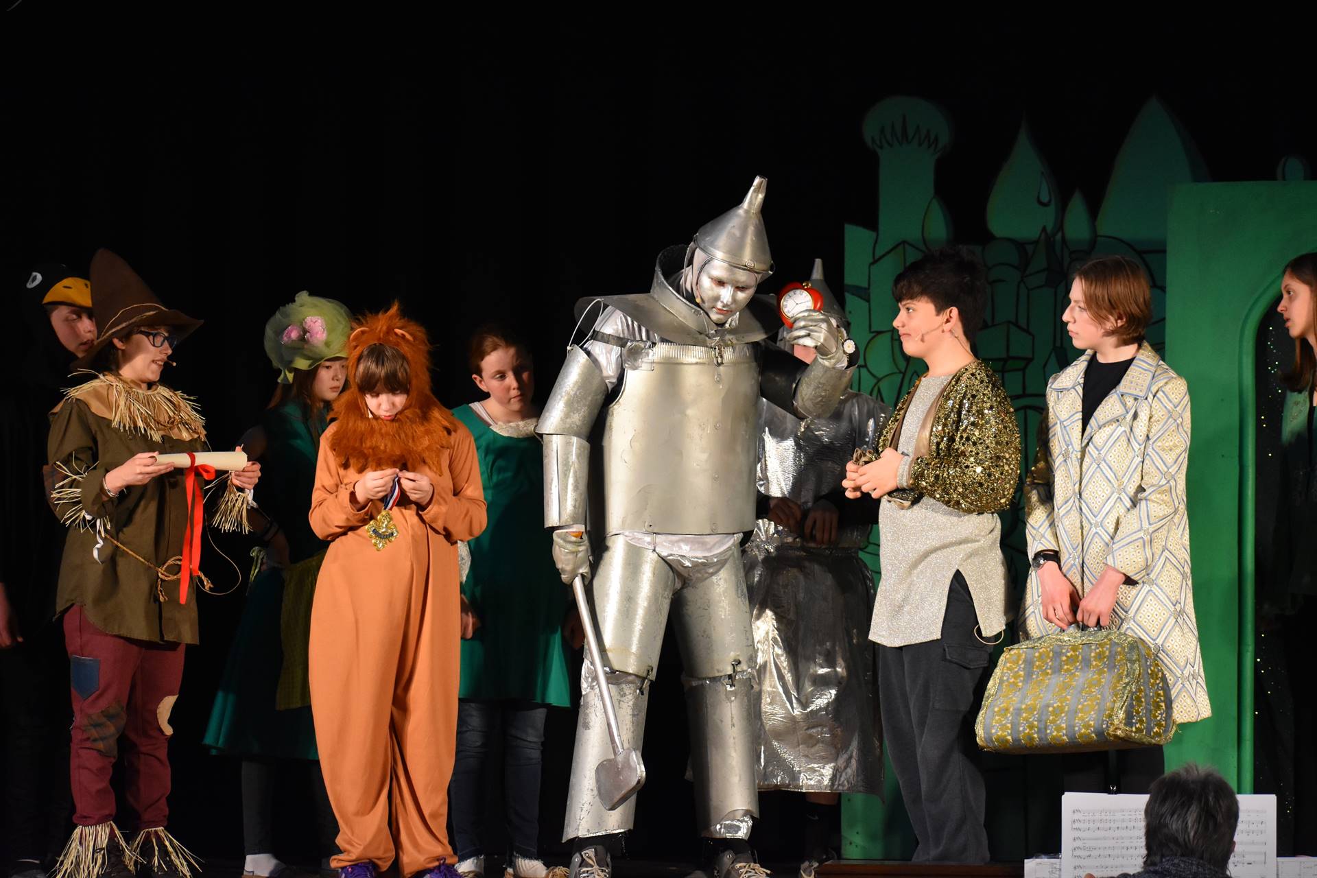 Tin Man, Lion and two male cast members and one female cast member