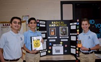 Three boys with science fair project