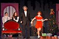 A student performance of Annie with the character Annie and Daddy Warbucks.